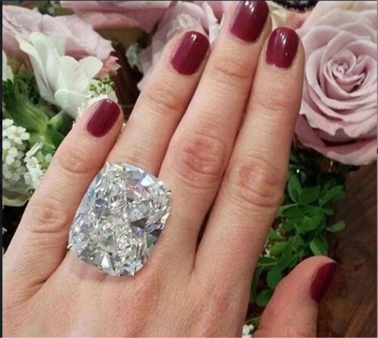 Women's simple inlaid white square diamond alloy ring with a geometric design on a finger.