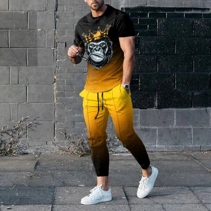 Man wearing a printed short-sleeve t-shirt and matching trousers from a cotton-like men's tracksuit set.