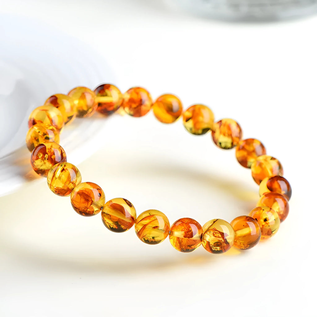 Natural yellow piebald amber bracelet with flower spot pattern for water purification