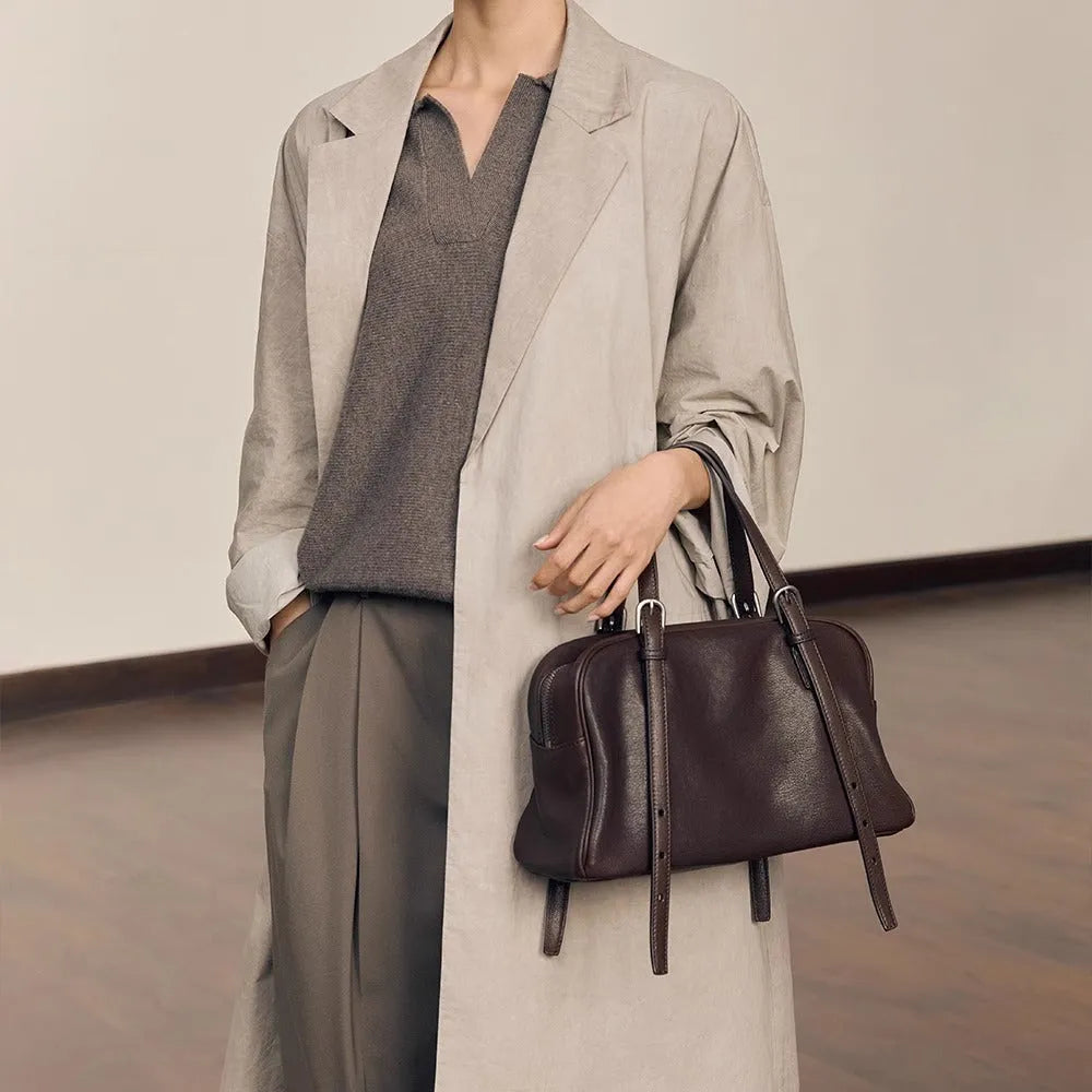 Women's black genuine leather retro shoulder bag showing horizontal square shape and double shoulder straps