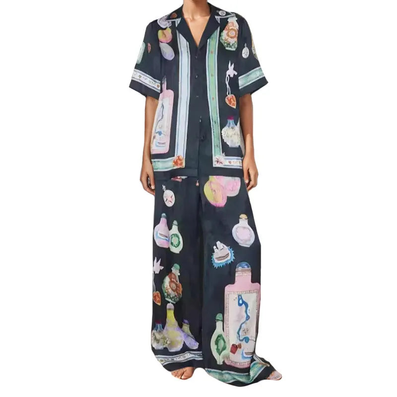Black women's casual set with cartoon pattern featuring cardigan-sleeve top and matching trousers