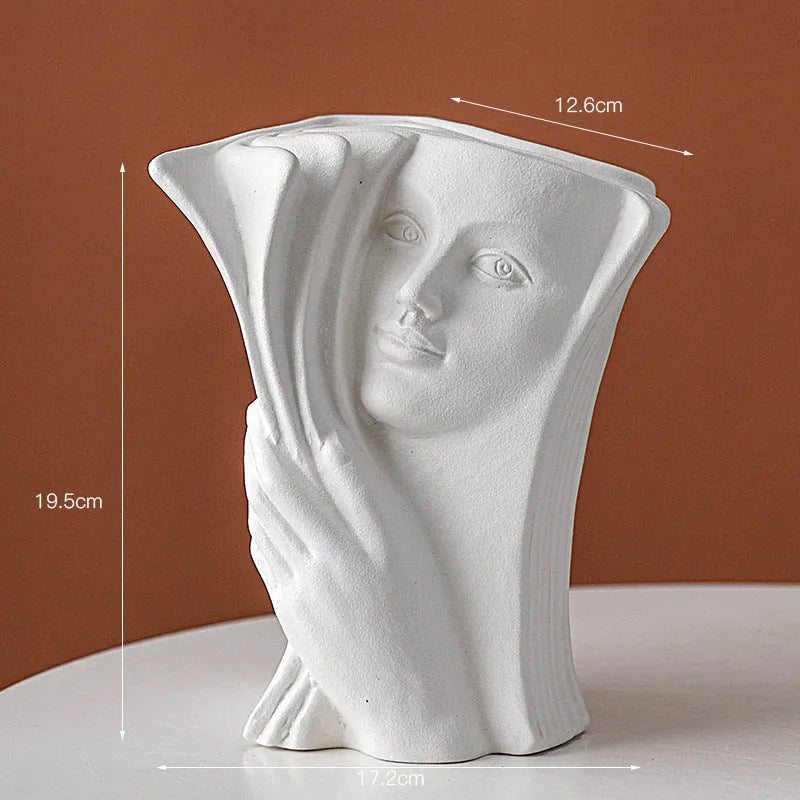 Ceramic book stand in a modern simple style with a glazed decorative pattern, holding a book upright.