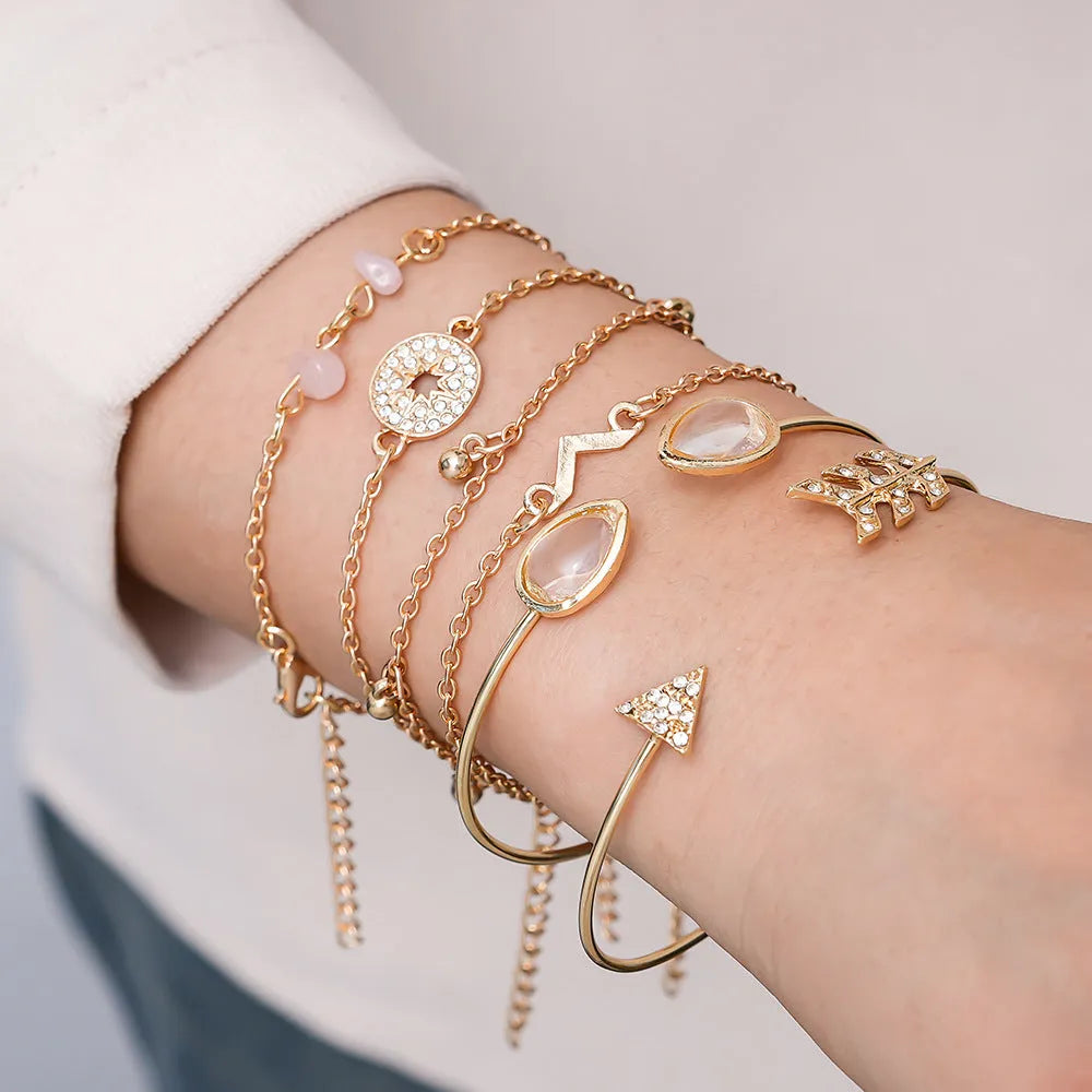 Six golden bracelets with spot drill, arrow, water drop and V-shaped pendants on zinc alloy chains