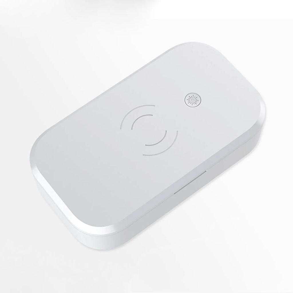 White ultraviolet disinfection box with wireless charging for mobile phones and beauty tools.