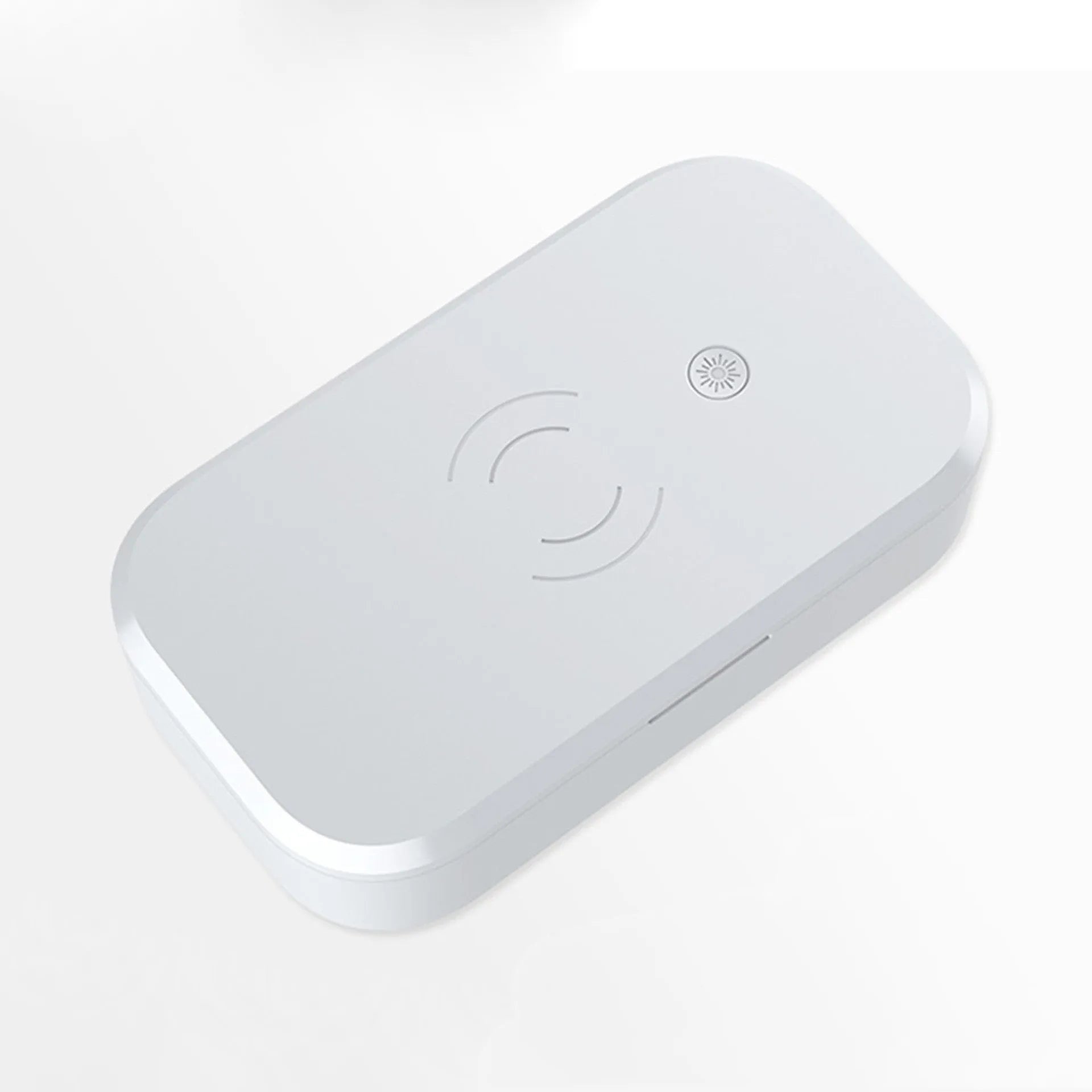 White ultraviolet disinfection box with wireless charging for mobile phones and beauty tools.