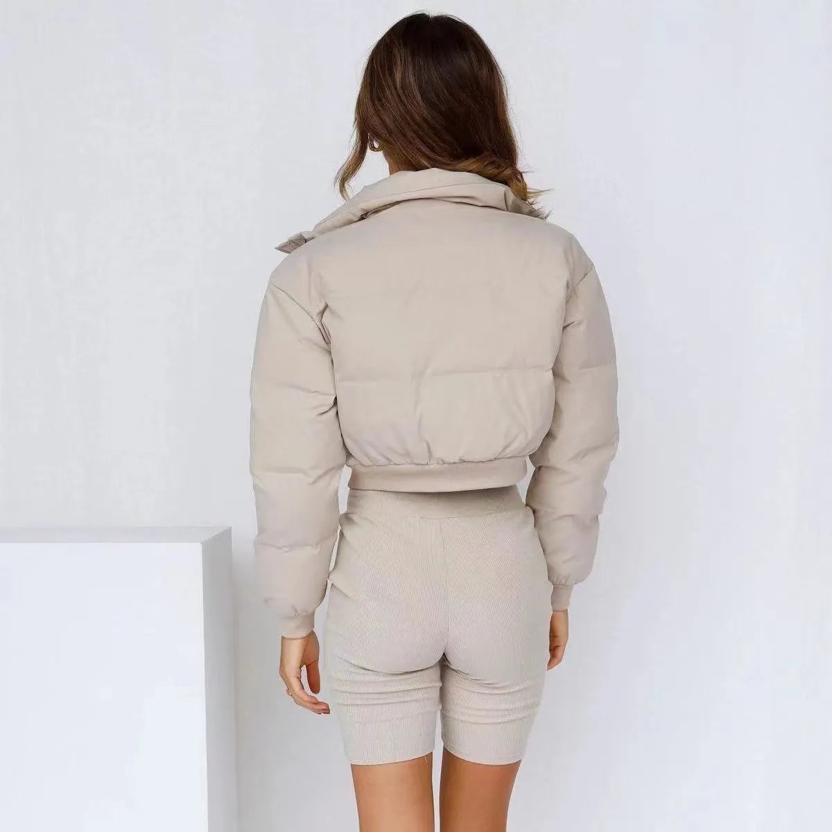 Women's loose blue polyester jacket with regular long sleeves showing front view
