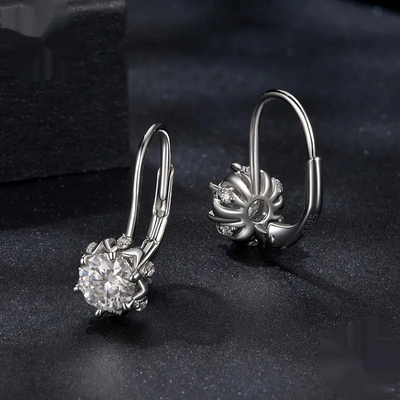 Sterling silver flower bud clip earrings with moissanite stones and white gold plating