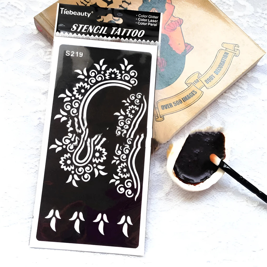 Sheet of hollow geometric and Southeast Asian style temporary tattoo templates on water transfer paper.