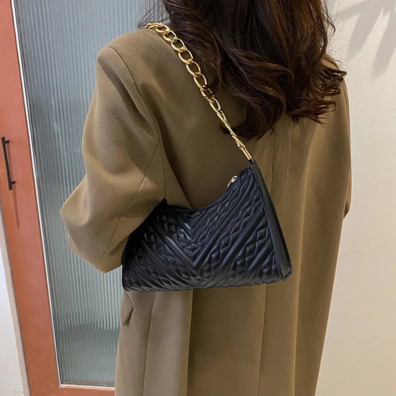 Brown pleated chain baguette shoulder bag showing vertical square shape and adjustable 50cm strap