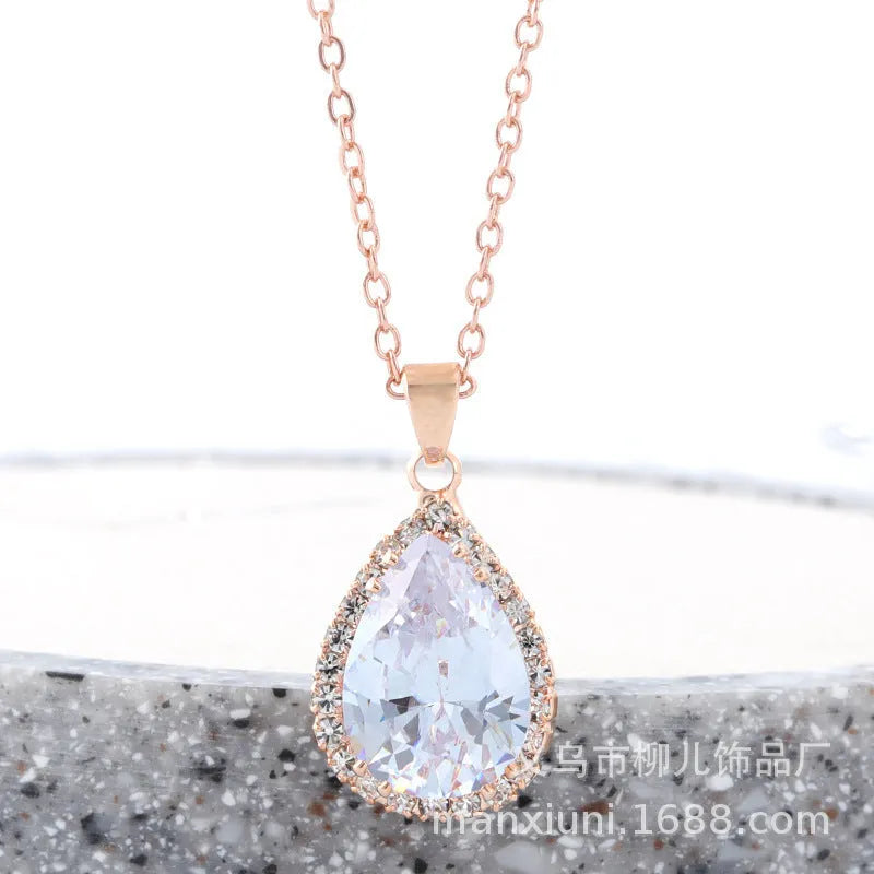 Rose gold pink drop shape women's necklace with geometric rhinestone detailing and alloy construction