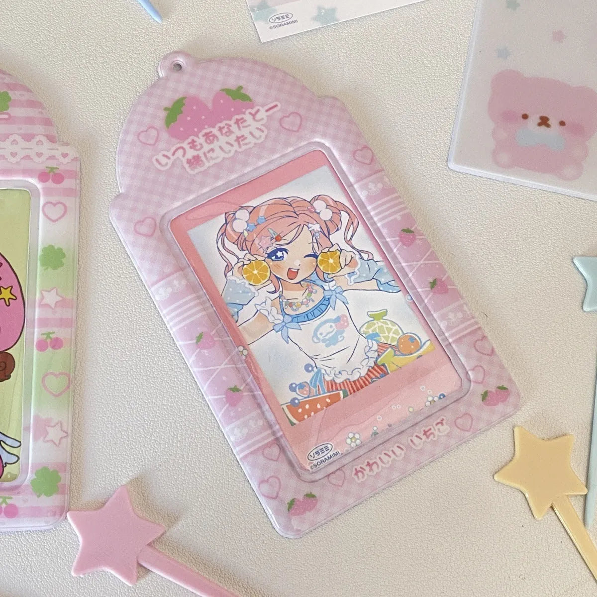 Cartoon plaid strawberry design PVC card holder pendant for lanyards, measuring 7.6 by 13.6 centimetres.