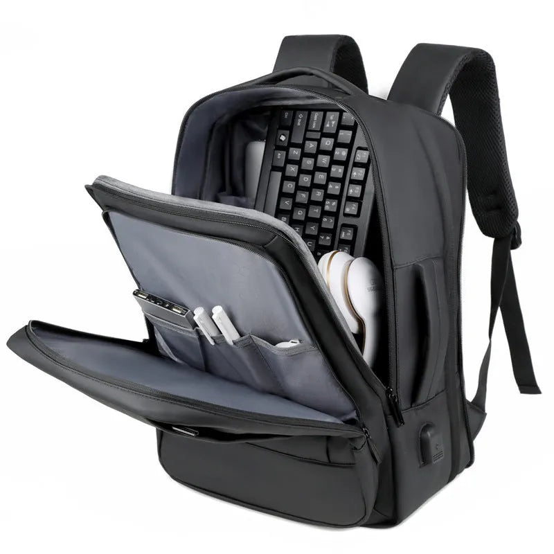 Black business backpack with curved shoulder straps showing waterproof Oxford cloth construction