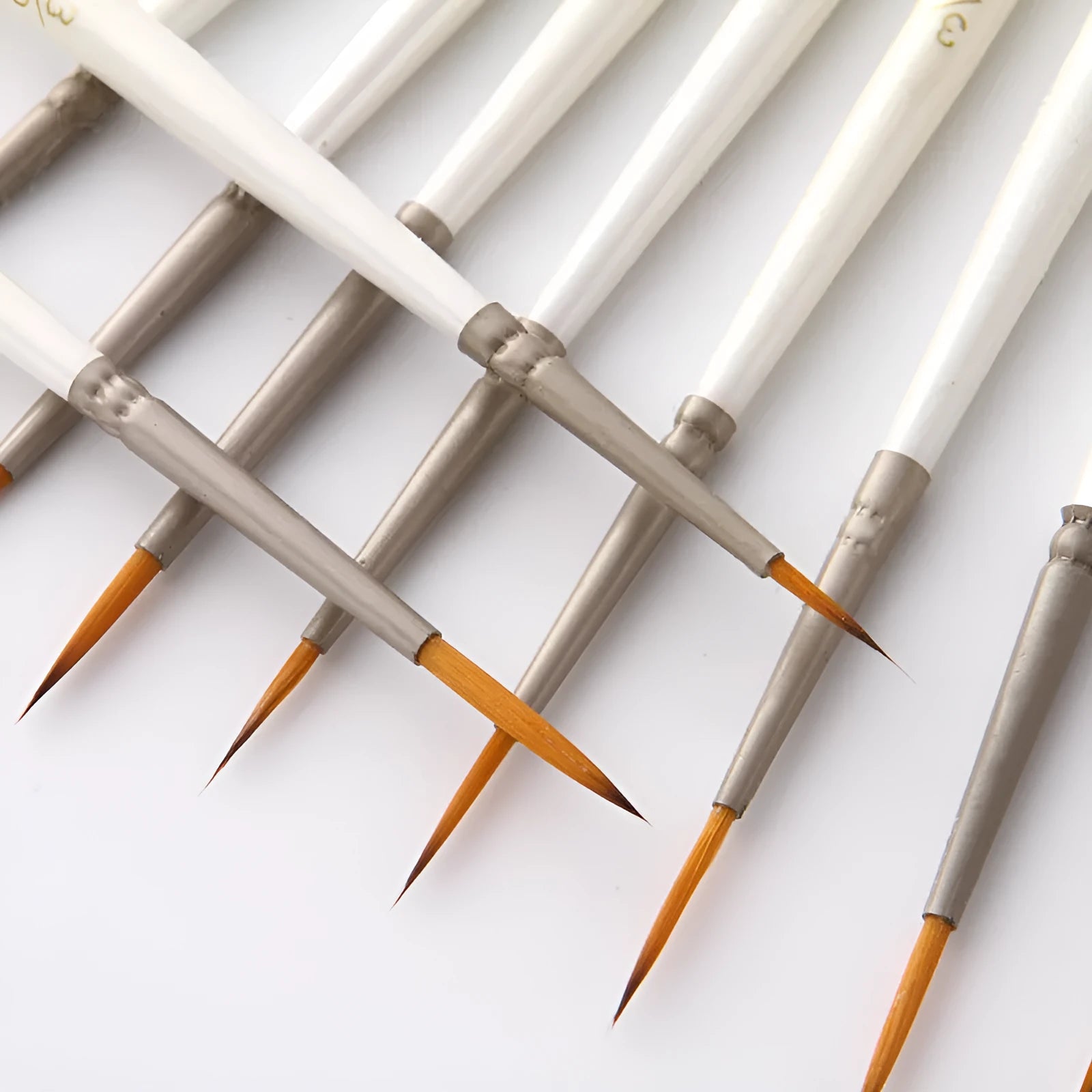 Twelve pearl white fluorescent marker pens with nylon wool brushes and wood holders for watercolour and acrylic painting