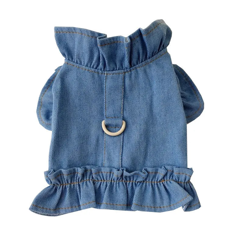 Blue denim pet dress with ruffle trim and leash hook attachments on chest and back