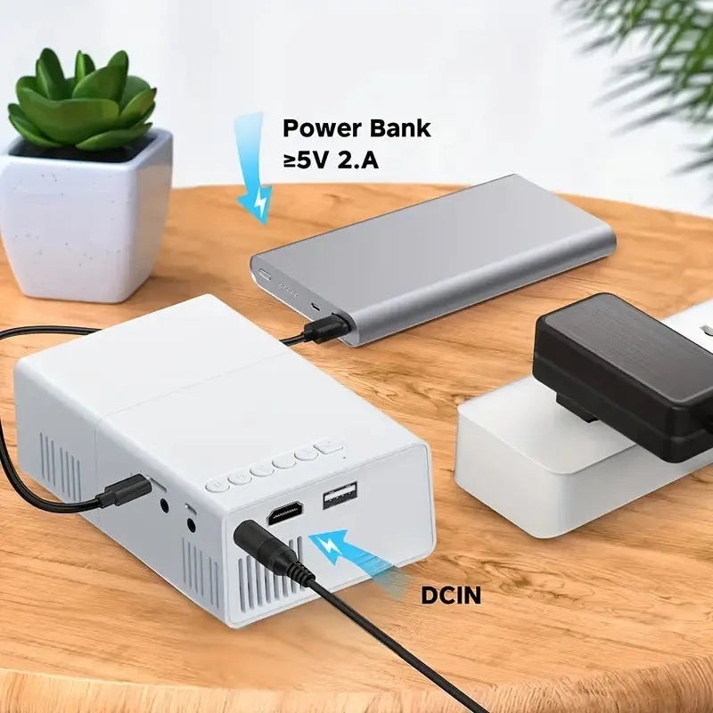 M100 mini portable LED projector in black or white with remote control and cables