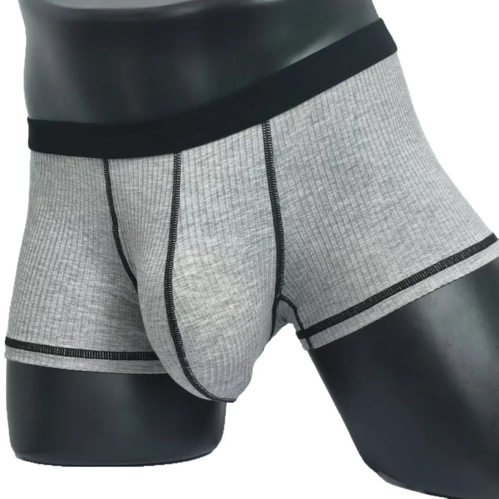 Men's solid colour boxers in breathable fibre fabric showing hip-lifting design