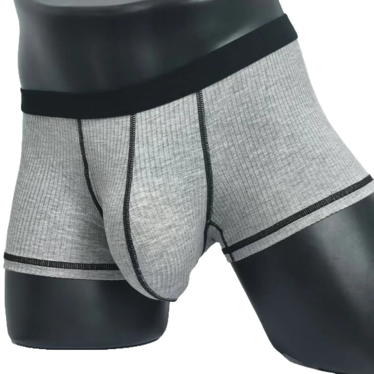 Men's solid colour boxers in breathable fibre fabric showing hip-lifting design
