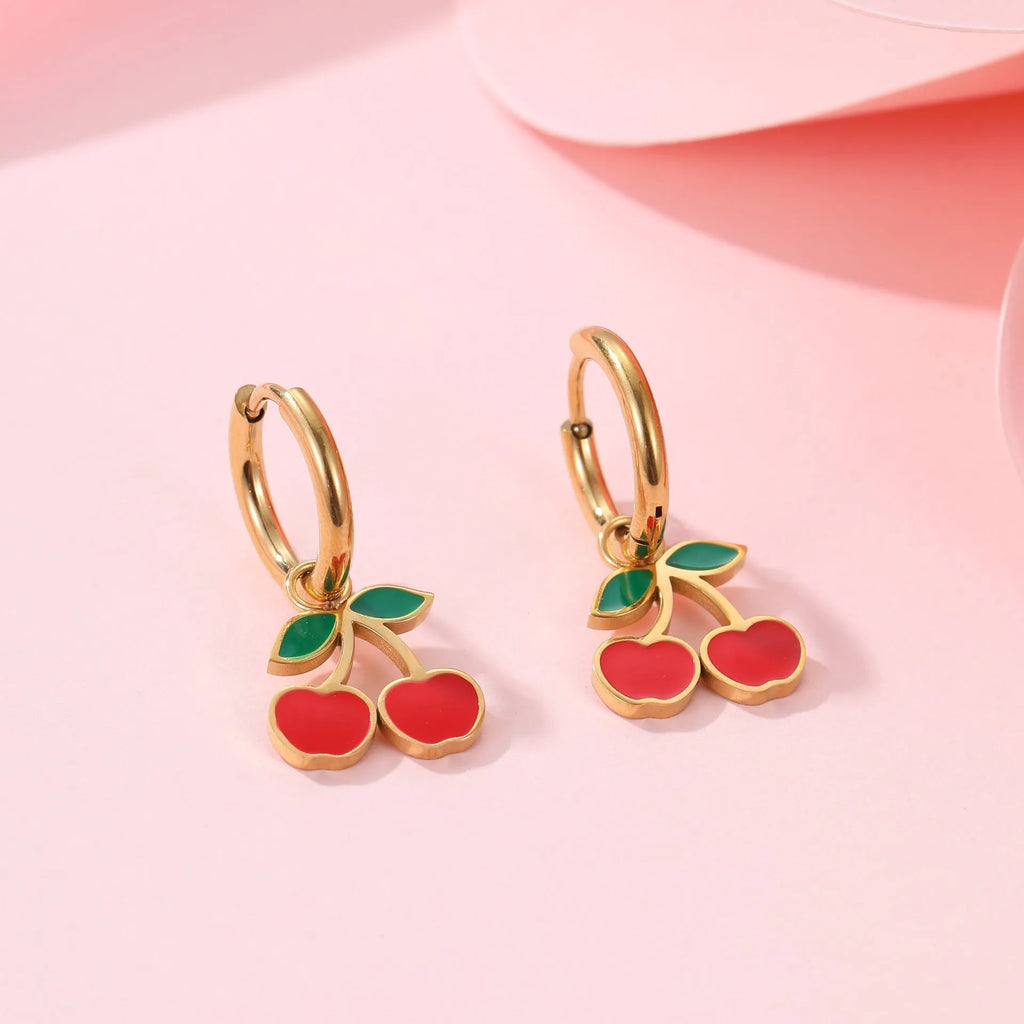 Cherry jewellery set with stainless steel necklace, bracelet, earrings, and ring featuring geometric shapes and 18K plating