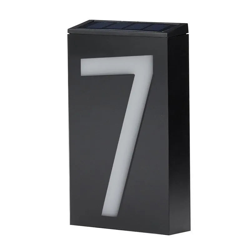 Solar powered house number light with 6 LEDs and IP65 waterproof rating mounted on an exterior wall.