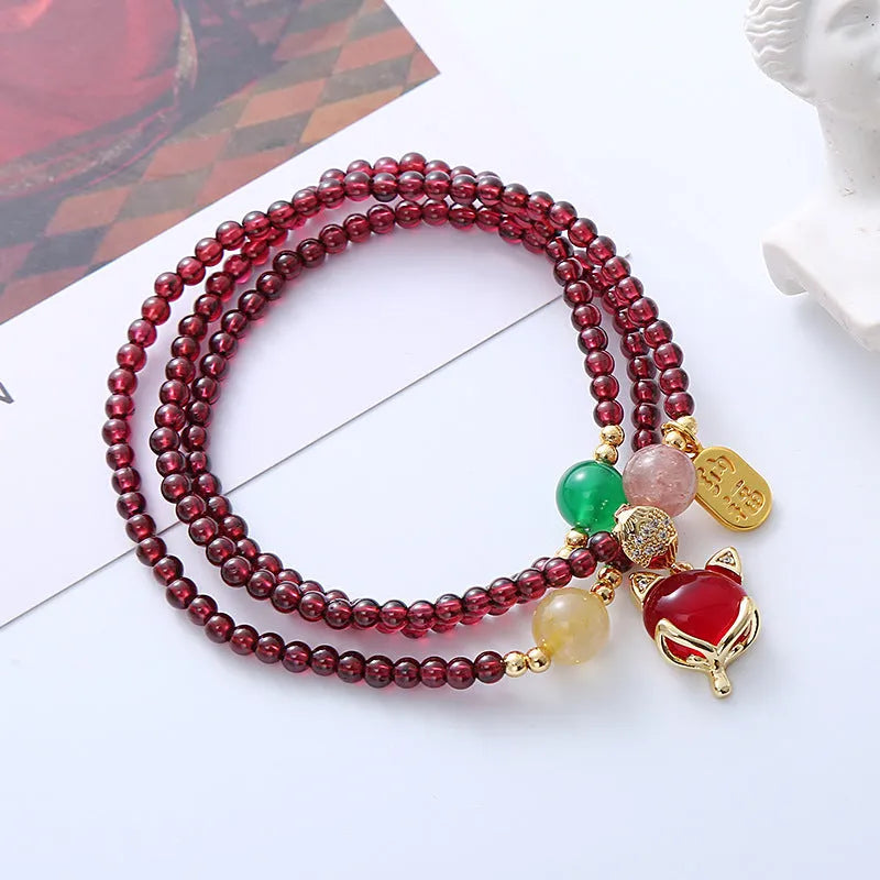 Purplish red garnet fox bracelet with adjustable cord for women