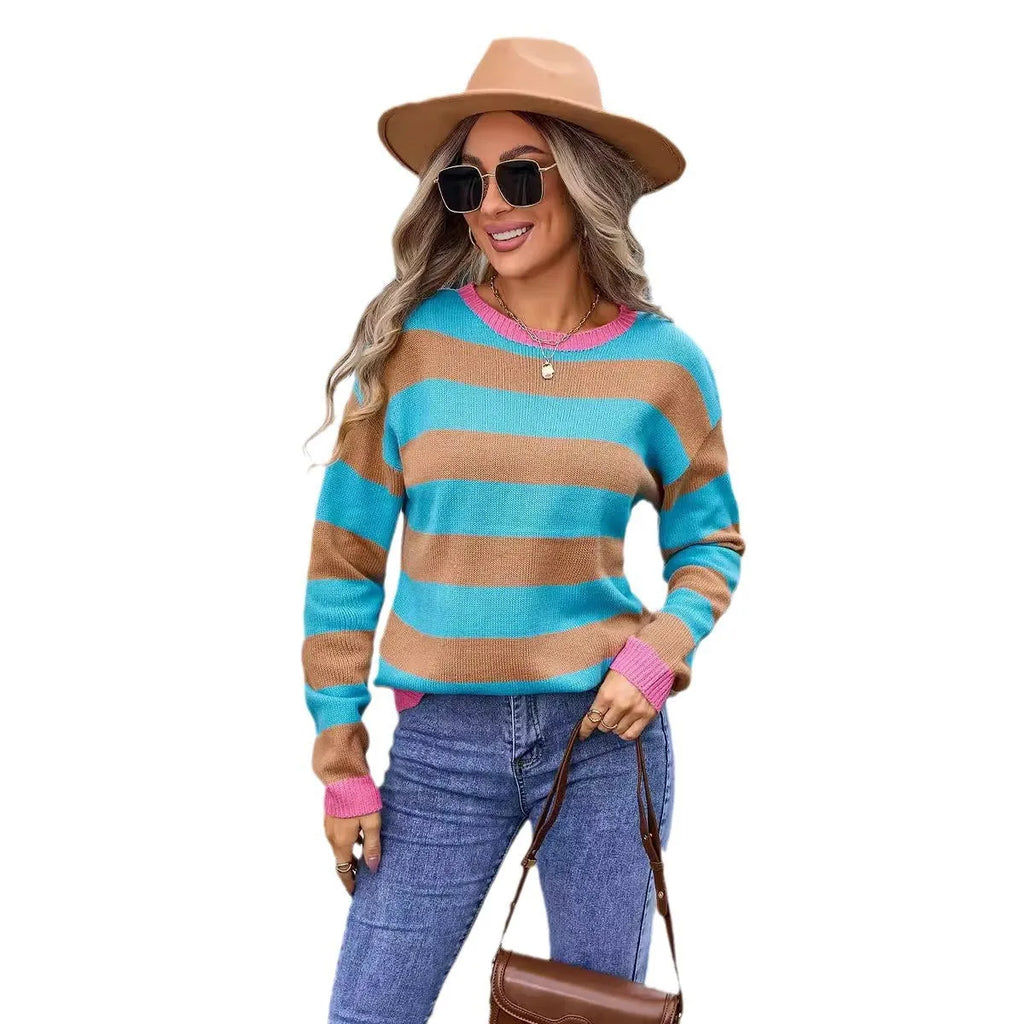 Women's loose-fit long sleeve floral sweater in blue, acrylic fabric, round neck.