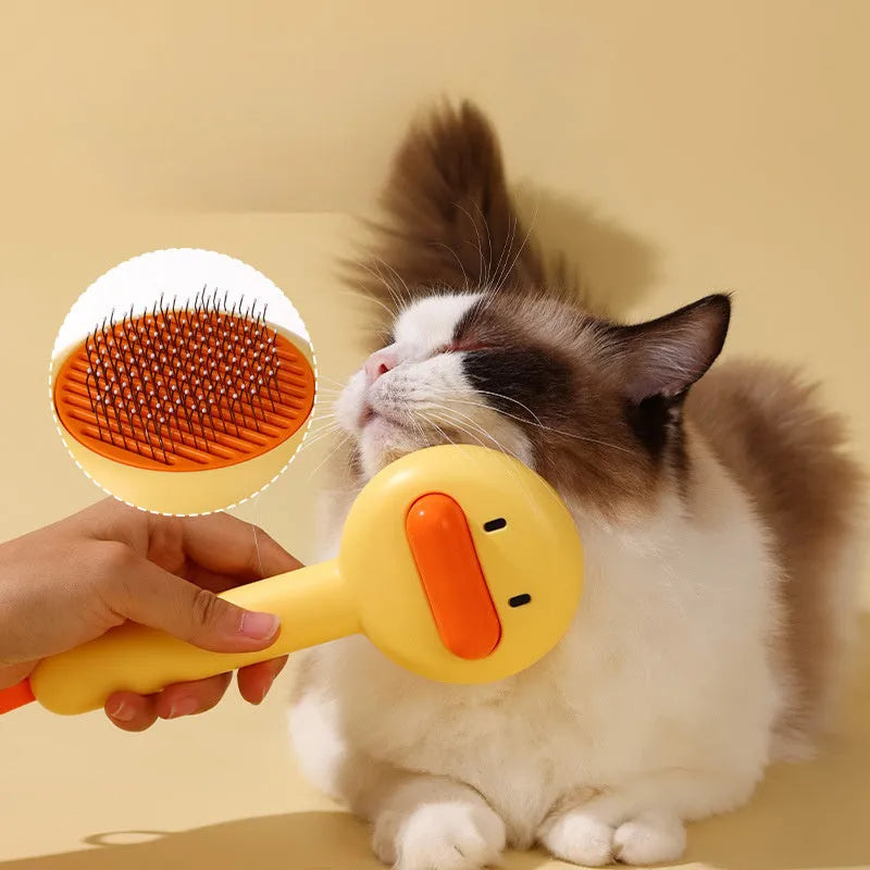 Small yellow duck-shaped pet grooming comb with open section and needle teeth