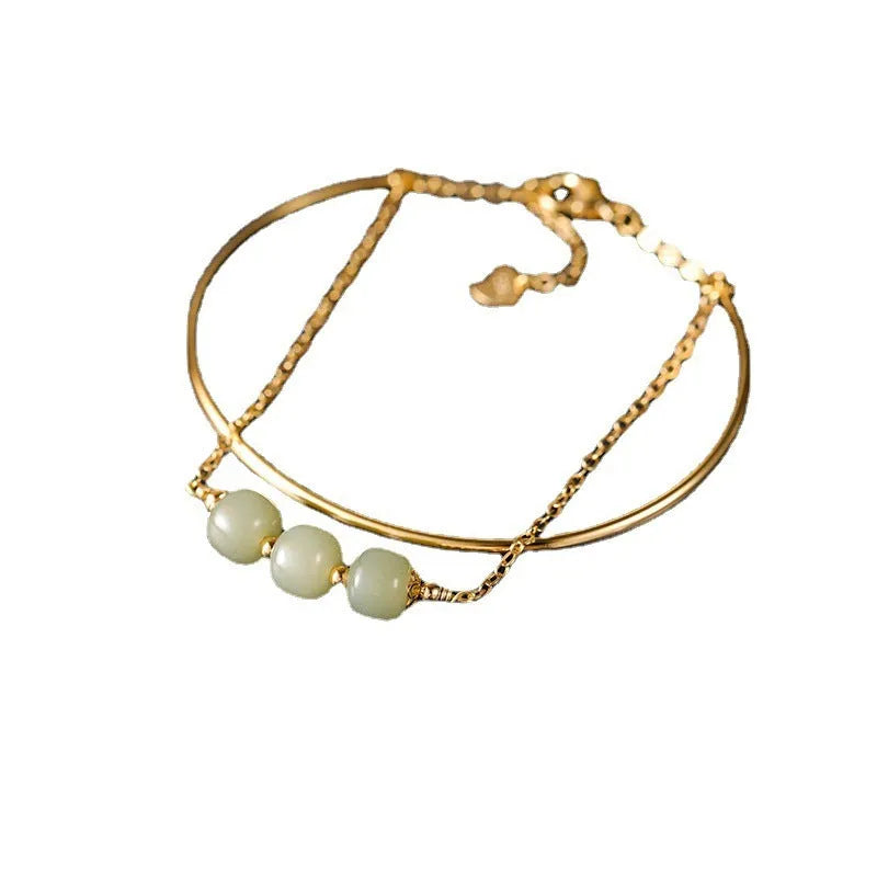 Women's Hetian jade bracelet with gold inlay detail, shown in single, double, and three bead versions.