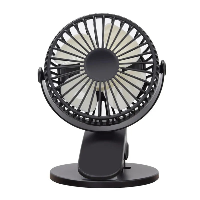 White USB rechargeable clip fan with plastic blades attached to a desk edge.