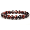 Natural tiger eye crystal beaded bracelet for men and women on a white background.