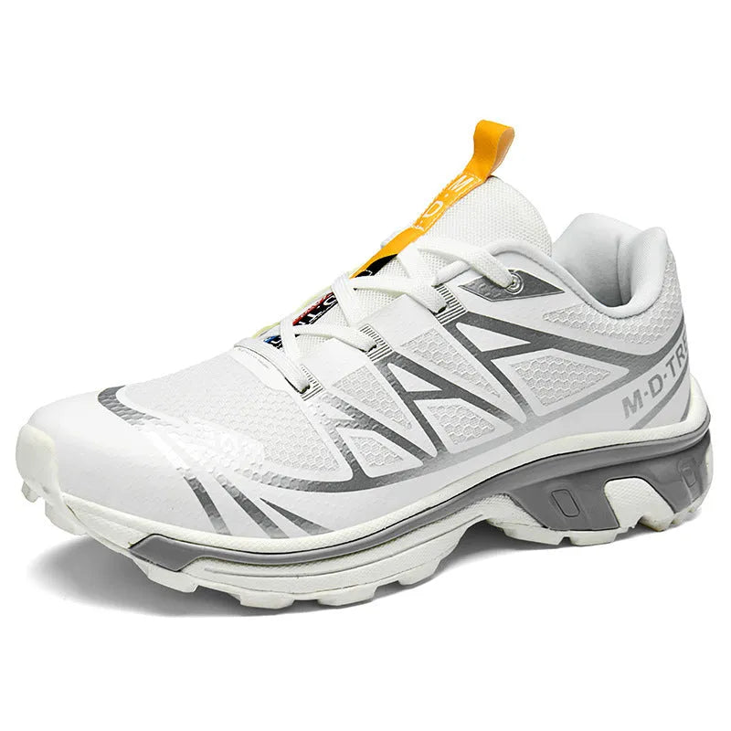 Low-top hiking shoes in khaki with rubber soles and front lace-up closure.