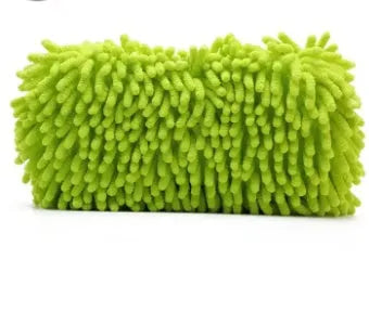Silver green rectangular car wash sponge block on a clean surface