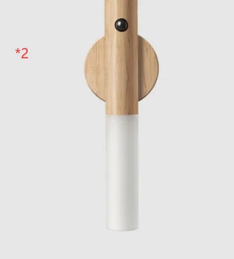 Smart sensor LED desk lamp in wood and glass, showing compact size and warm white light.
