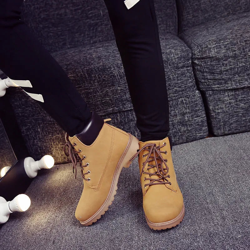 Pink high-top Martin boots with velvet lining and flat sole, shown with front lace-up.
