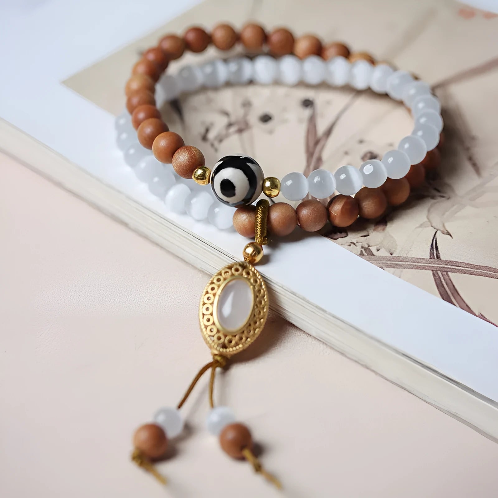 Mixed material bracelet with sandalwood double ring and opal Tibetan beads.