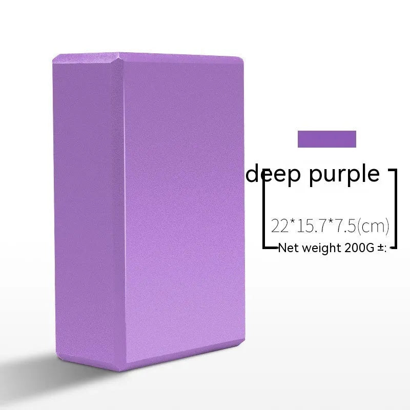 High-density EVA yoga block in violet colour next to a pink block with a cartoon print design.
