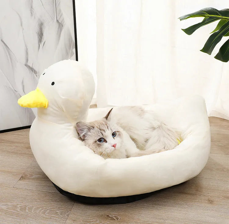 Duck-shaped fluffy pet bed in blue or white colours for small dogs and cats