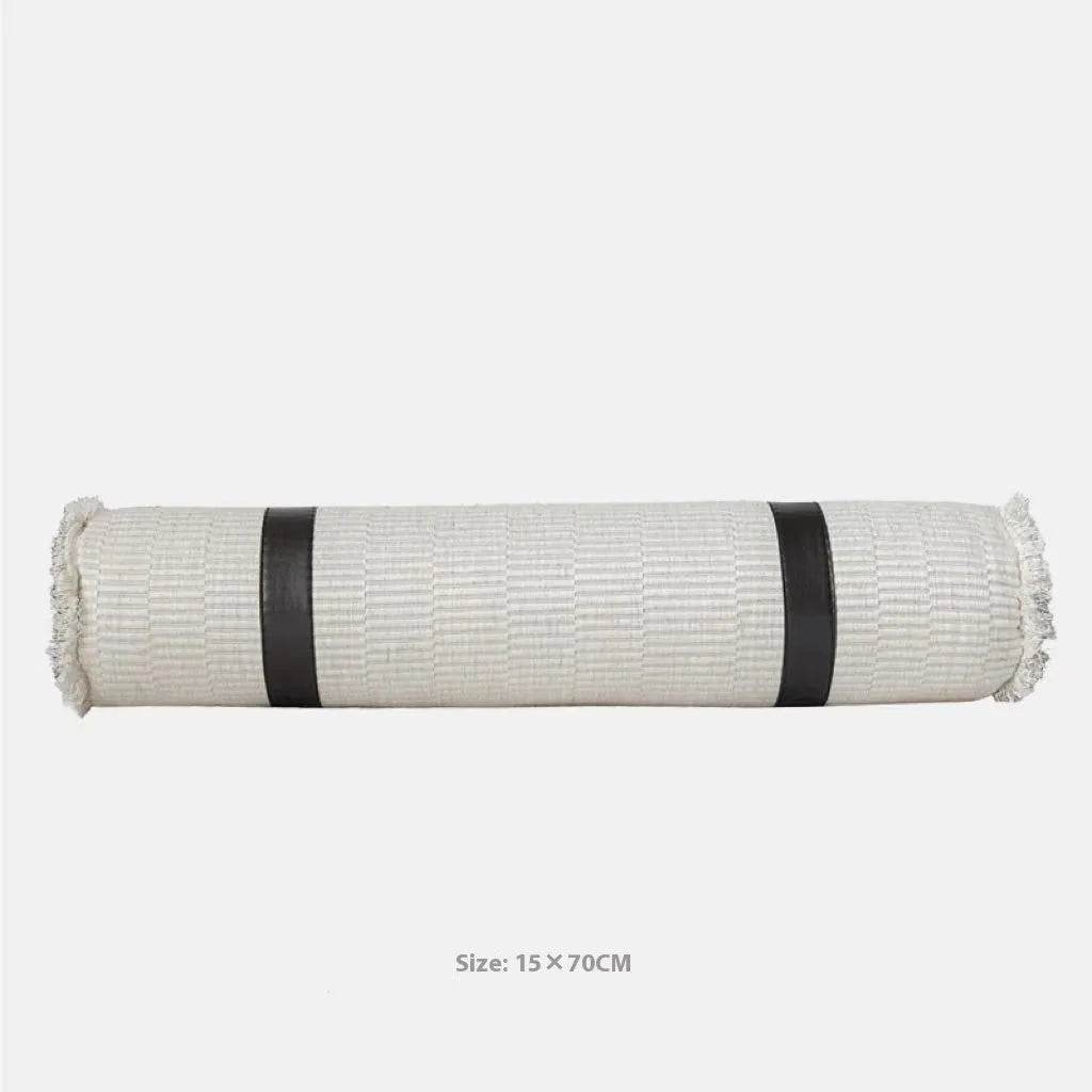 Grey and white plaid polyester bed runner blanket set with matching pillowcase and round leather-look cushion on a bed