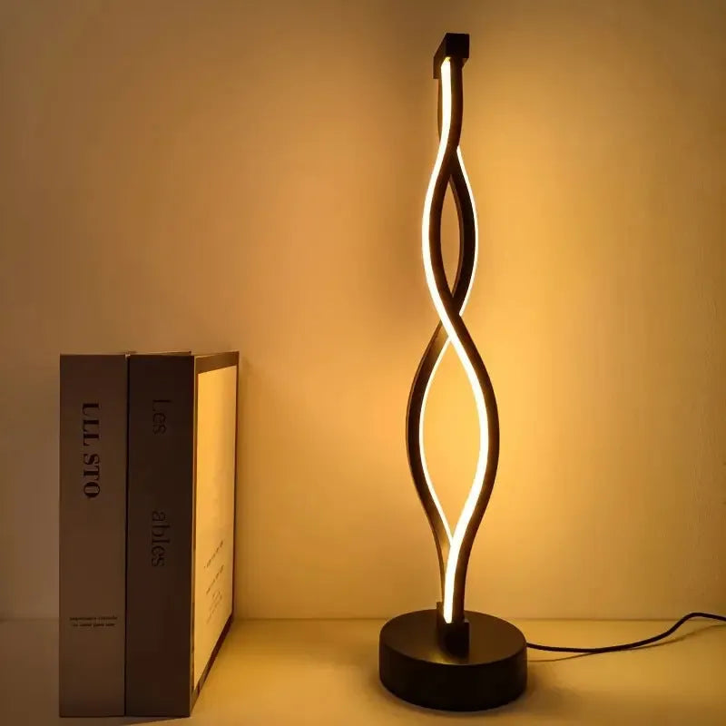 Black aluminium desk lamp with three-colour dimming button and touch controls.