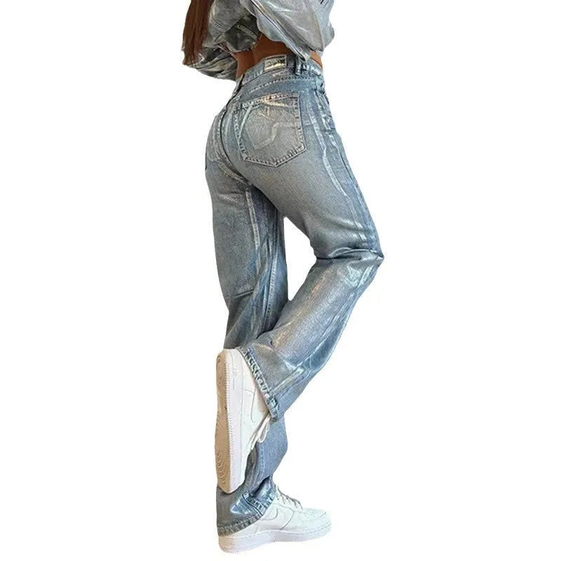 Washed blue high waist straight-leg jeans with contrast colour details on a mannequin.