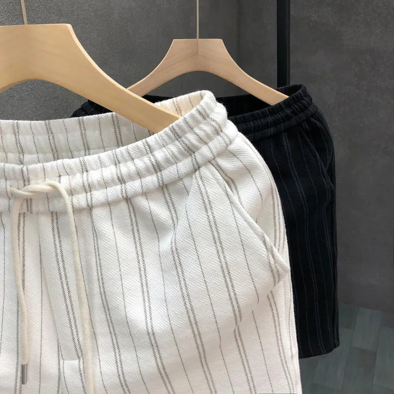 Men's black and white striped casual shorts with a fleece lining and double-layer waistband.