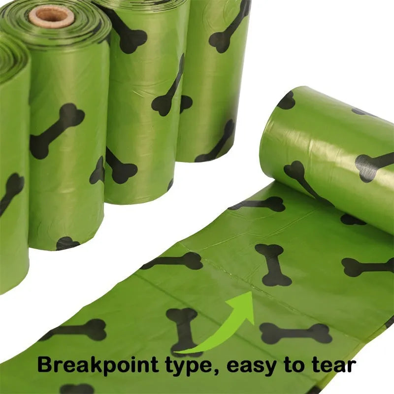 Roll of army green degradable dog waste bags with black bone print, showing bag size and dispenser.