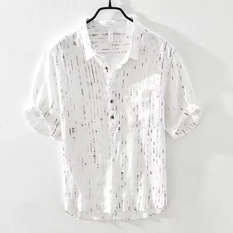 Men's loose fit short sleeve polo shirt in black, showing lapel collar and cardigan style