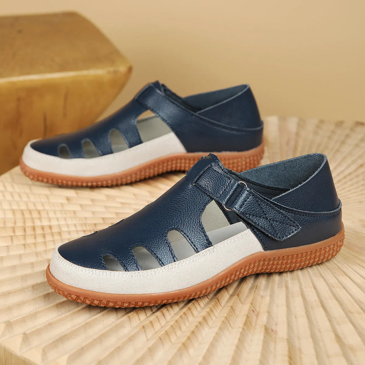 Plus size women's flat sandals with toe cap and hollow breathable design in blue, red, or white.