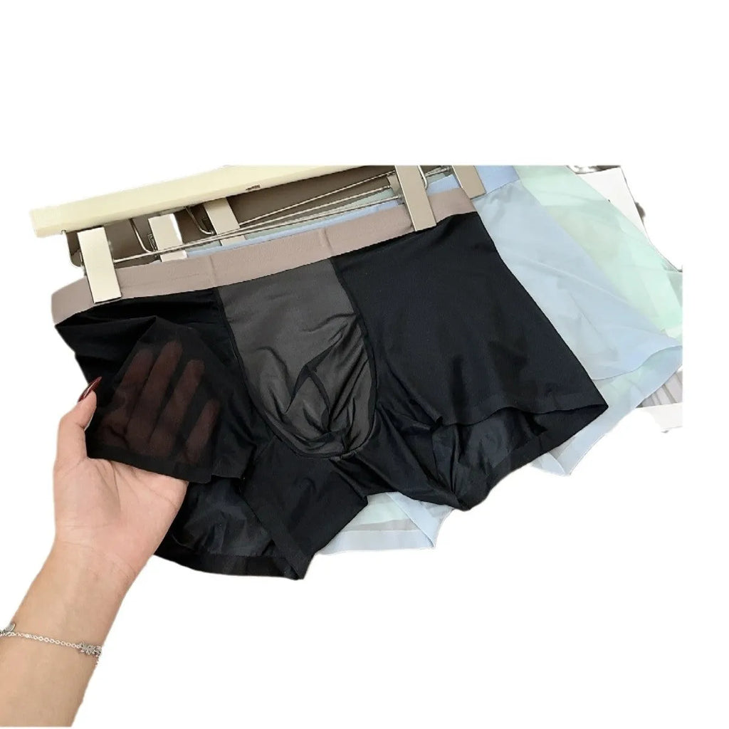 Ultra-thin seamless men's boxers in ice silk nylon with a honeycomb crotch, shown in black.