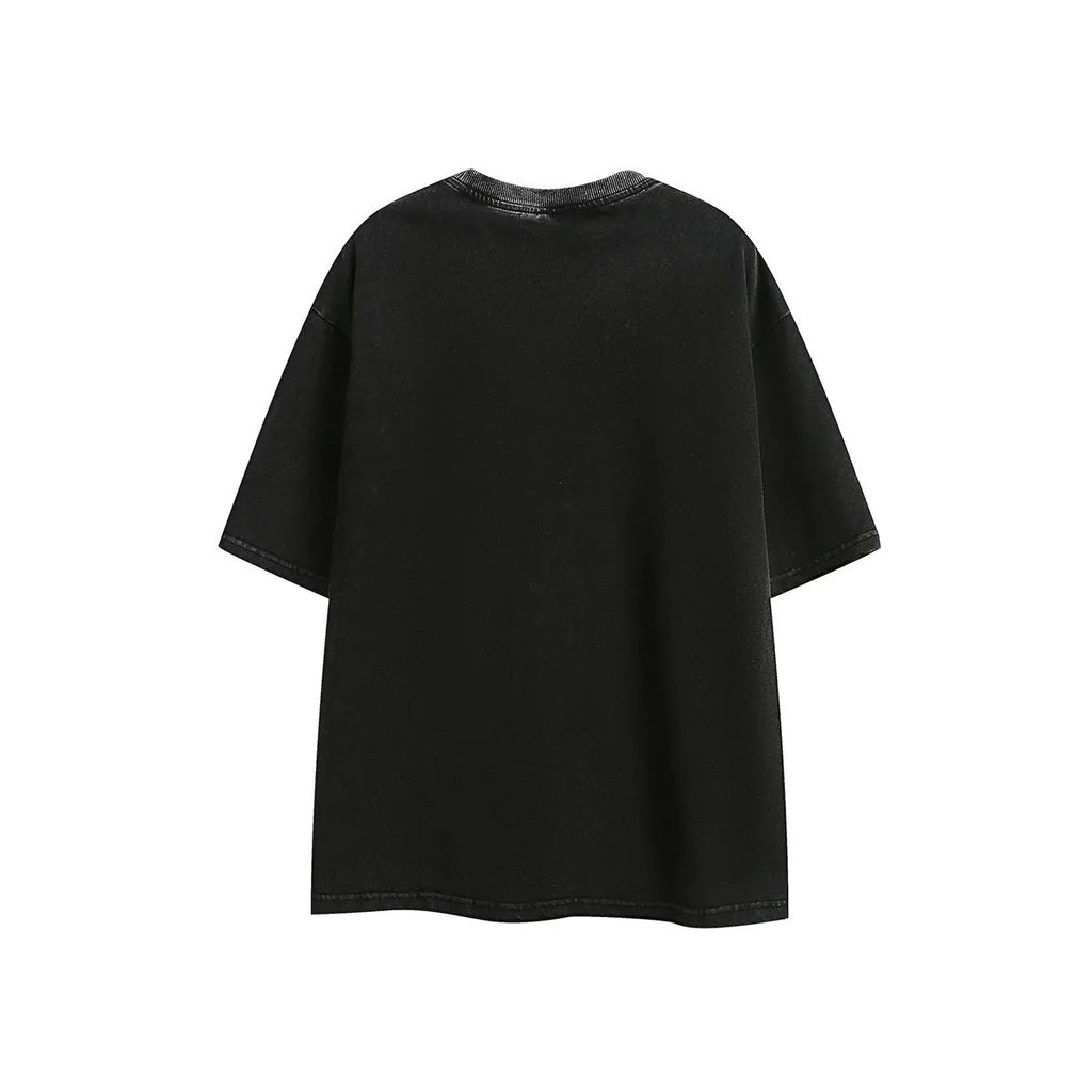 Purple loose-fit cotton t-shirt with embroidered detailing and a washed retro look on a hanger.