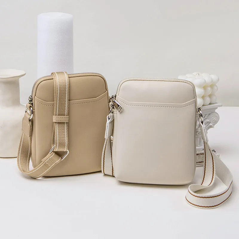 Small solid-colour PU crossbody shoulder bag for mobile phone.