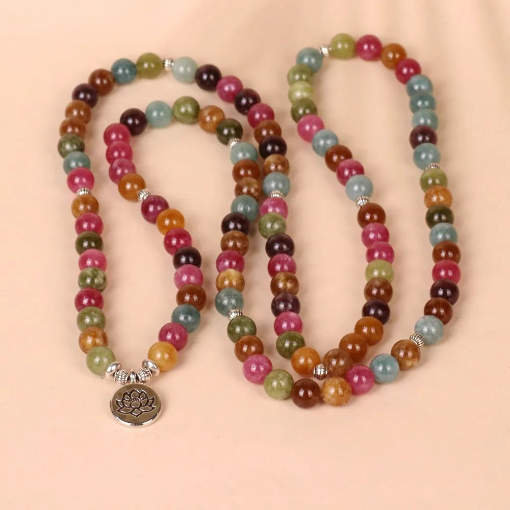 108 bead multi-layer bracelet with lotus pendant in Tourmaline colour and alloy construction.