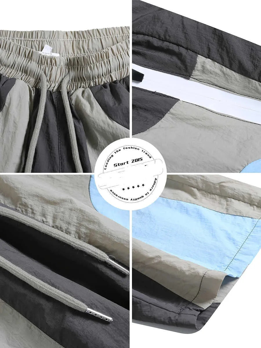 Blue men's patchwork loose-fit quick-drying shorts laid flat, showing straight-leg cut and tether fly.