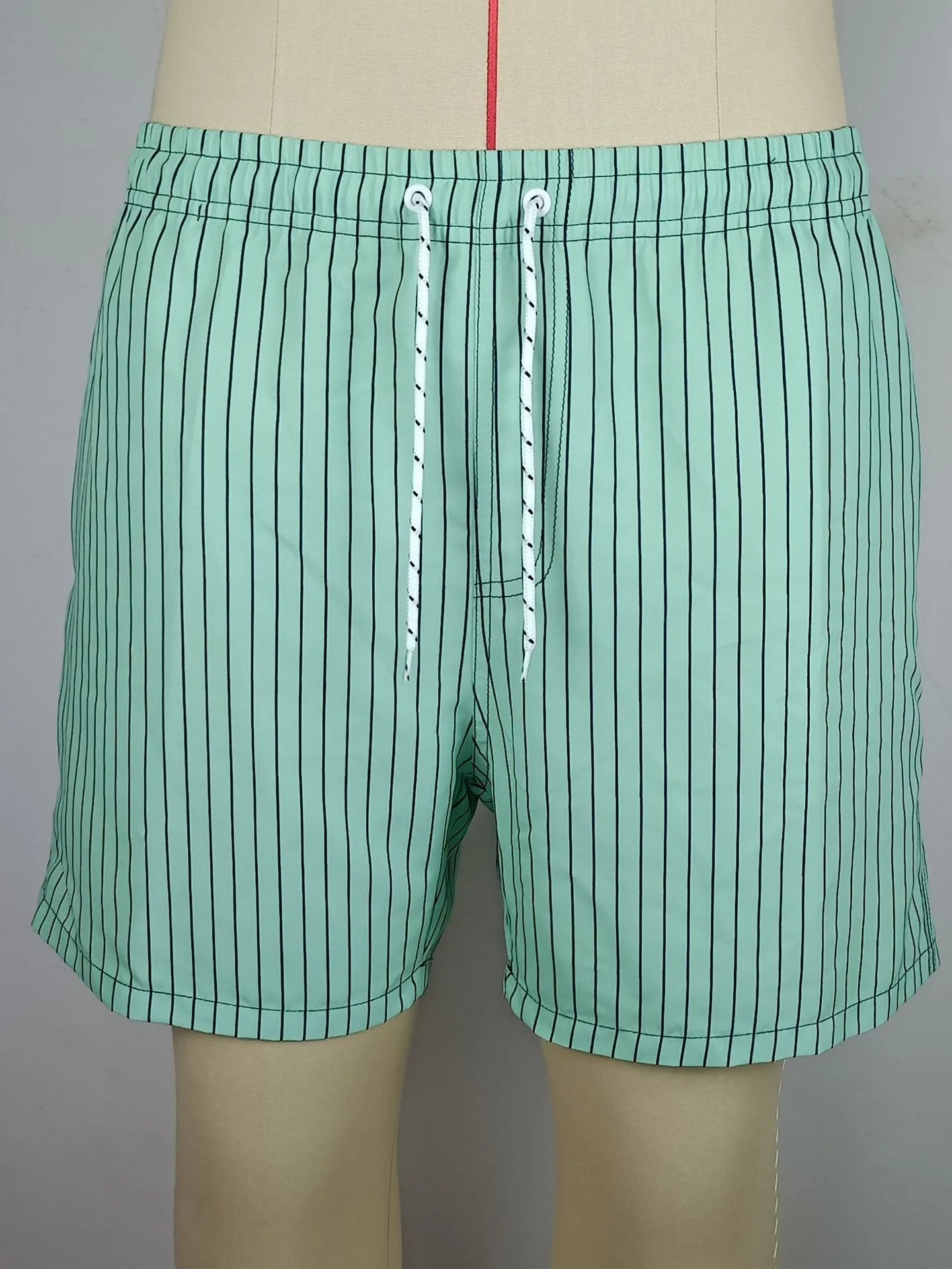 Men's striped beach shorts with straight legs and triangle lining in polyester fibre blend fabric