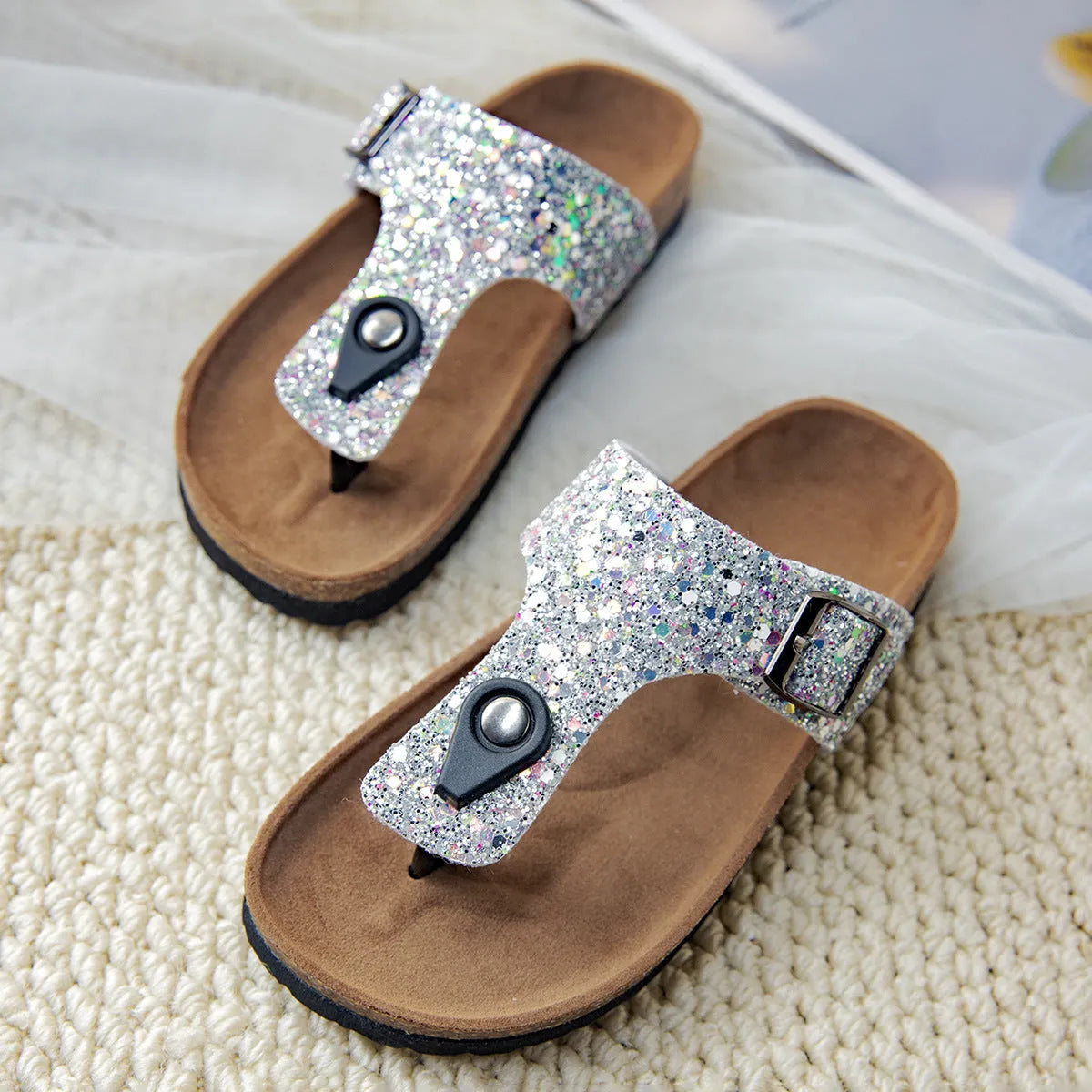 Gold frosted cork flip-flop slippers with hollow-out design and non-slip PVC sole.